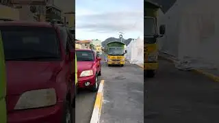 These decorated, natural air-conditioned buses stand ready to give the tourists a ride of a lifetime