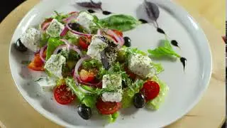 A Serving Of Vegetable Salad With White Cheese