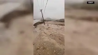 Floodwaters close roads in San Bernardino County, California