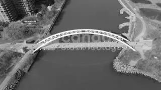 Modern pedestrian bridge top view stock video. Humber Bay Arch Bridge. Black and white. 4K.