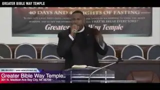 Pastor Phillip Johnson preaching the 