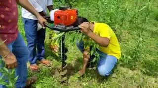 sample for soil testing using earth auger, creating hole 2.5 feet deep and 3 inch wide