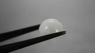 Selenite (Gypsum) cat's-eye cabochon.  RGYP50