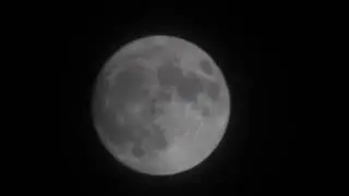 Super Moon with UFO crossing the Moon