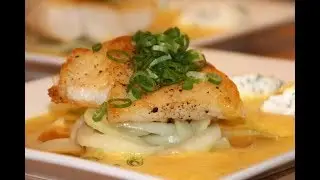 Pavé de lieu jaune accompagné de ses quenelles de fromages frais aux herbes.