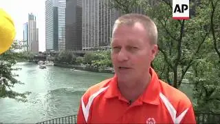 Spectators who gathered along the Chicago River watched thousands of rubber ducks pushed toward the