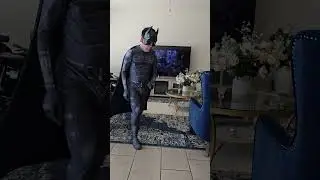 Batman fighting joker's thugs at the alley 