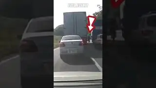 Cyclist Stuck Between Two Trucks