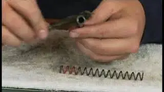 Brushing the Spring Rod of a Sig Sauer 226 9mm Gun