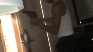 Nle Choppa with guns in the hotel room
