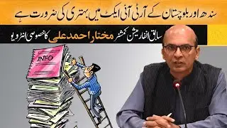 Mukhtar Ahmed Ali talking to 
