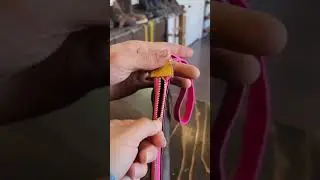 Custom LV Clutch with a pink zipper and a matching wrist strap