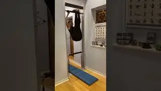 Archival Pilates exercise on the Guillotine/Gym in a Doorway