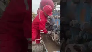 Oil workers perform on-site operations to replace pistons for drilling mud pumps