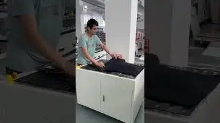 Semi automatic clothing folding packaging machine