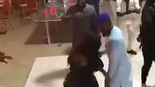 Lady removes her wig during legwork at wedding