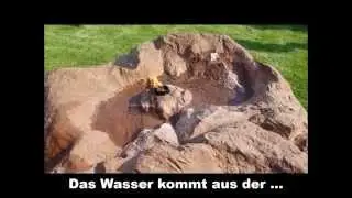 Quellstein aus Kunstfelsen mit einer outdoor Fackel - Stone Illuion