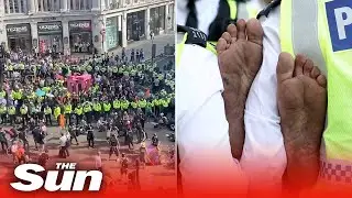 Extinction Rebellion protesters glue themselves to the road and block London's Oxford Circus