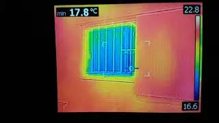 Thermal camera shows heat loss through an exposed house window (blinds open)