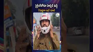 A Constable Wearing A Helmet While Riding A Bicycle Is Raising Awareness About Road Safety