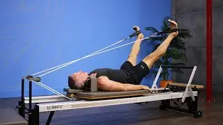 Feet in Straps - X Bend and Stretch on Pilates Reformer