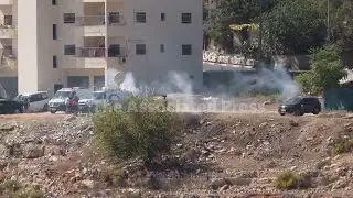 Israeli military vehicles fire tear gas at crowds awaiting prisoner releases in West Bank