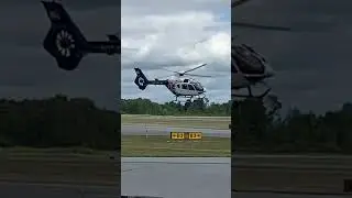 Medical helicopter takeoff along a taxiway