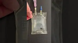 Precipitate formation when calcium gluconate is injected into a phosphate containing IV solution