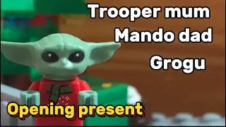 Trooper mum, Mando dad and Grogu open presents in Lego