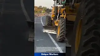 Road Maintenance Work: Heavy Motor Grader Smoothing Highway Surface