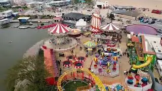 Low flying Aerial footage of Skegness Seafront,Funfair and Town.