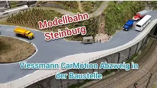 Modellbahn Steinburg. Viessmann CarMotion Abzweig mit IR-Mini in der Baustelle.