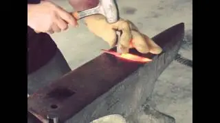 Stamping the Logo on the Hot Steel Blade