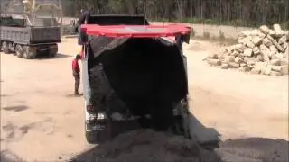 Truck with ejection shield system