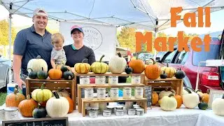 Selling Pumpkins and Candles at the Farmers Market on a Fall Day