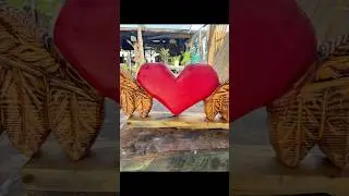 Chainsaw carving a heart with angel wings. Stihl ms170 msa 60 battery saw