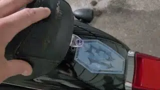 Removing the seat on a 2008 Harley Davidson Sportster 1200L.