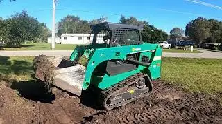 Grading a yard in Florida while on vacation