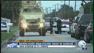 Barricaded man found dead in garage