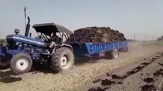 Farmtrac 70 full load trailer