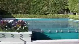 Subtle design creates a spacious minimalist feel in this outdoor living and pool area