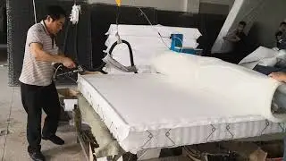 Spring mattress hot melt glue machine with manual glue gun for mattress glue spraying.