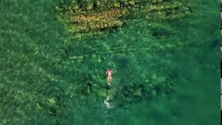 Video Background Stock Footage Free ( The girl floats in turquoise water )