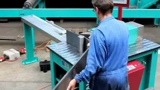 Vehicle beam flange bending