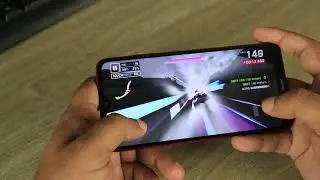 Person Playing A Game On Mobile Phone