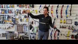 Come utilizzare un carichino a fascia per caricare un'arco Olimpico o Barebow