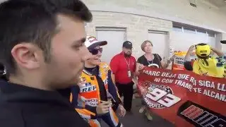 Marc Marquez hugs a child after taking pole position at Circuit of the Americas in Austin, Texas