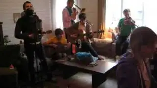 Parachutes play Tree Roots Turn To Forts in the lounge room