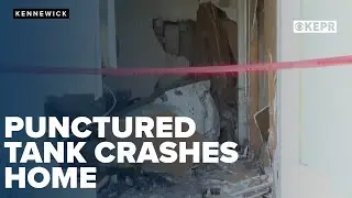 Punctured tank crashes through Kennewick home