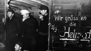 7.10.1955: Erste Spätheimkehrer erreichen Lager Friedland